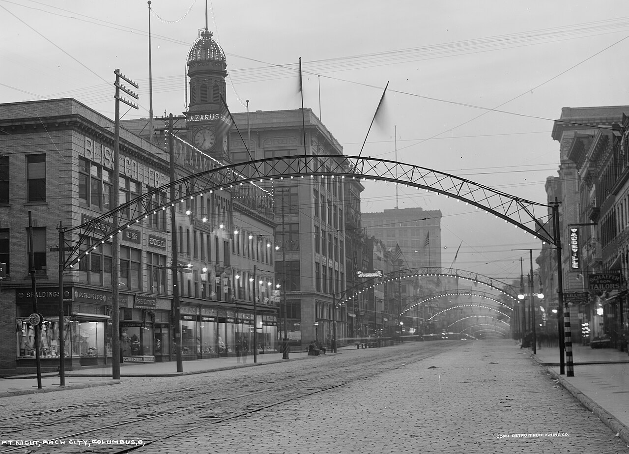 Historic High Street with illuminated arches and streetcar tracks in downtown Columbus